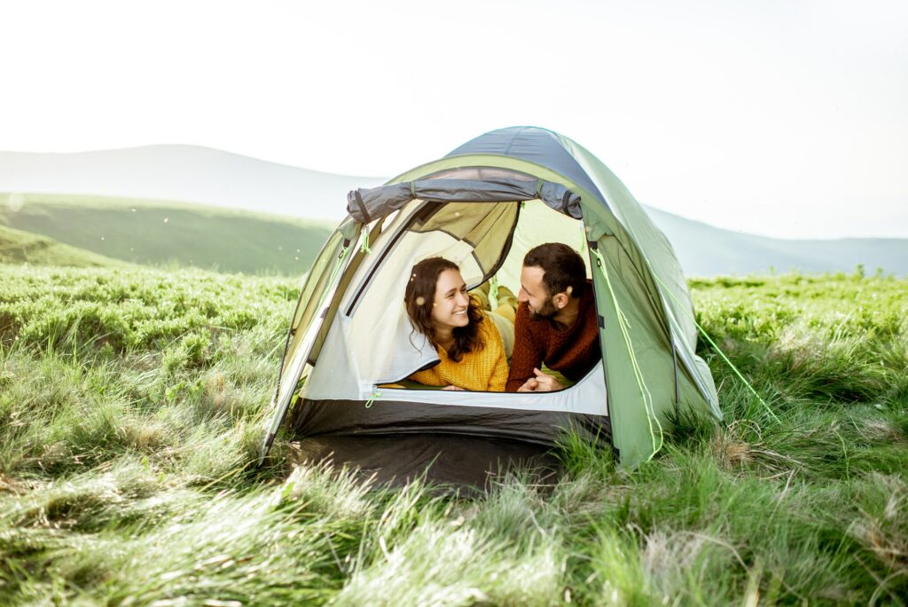 Couple with tent in the mountains
